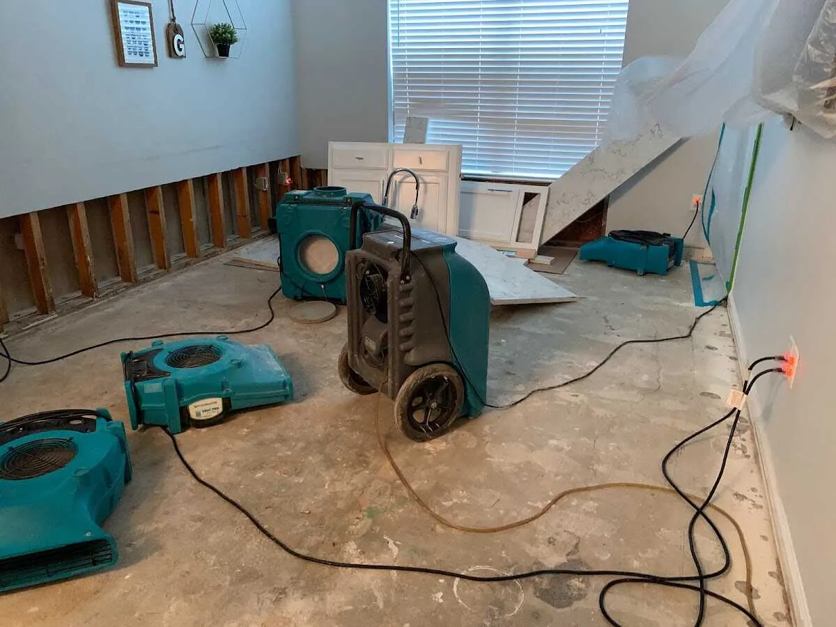 Dehumidifier in flood-cut room for Water Damage Restoration in Lexington